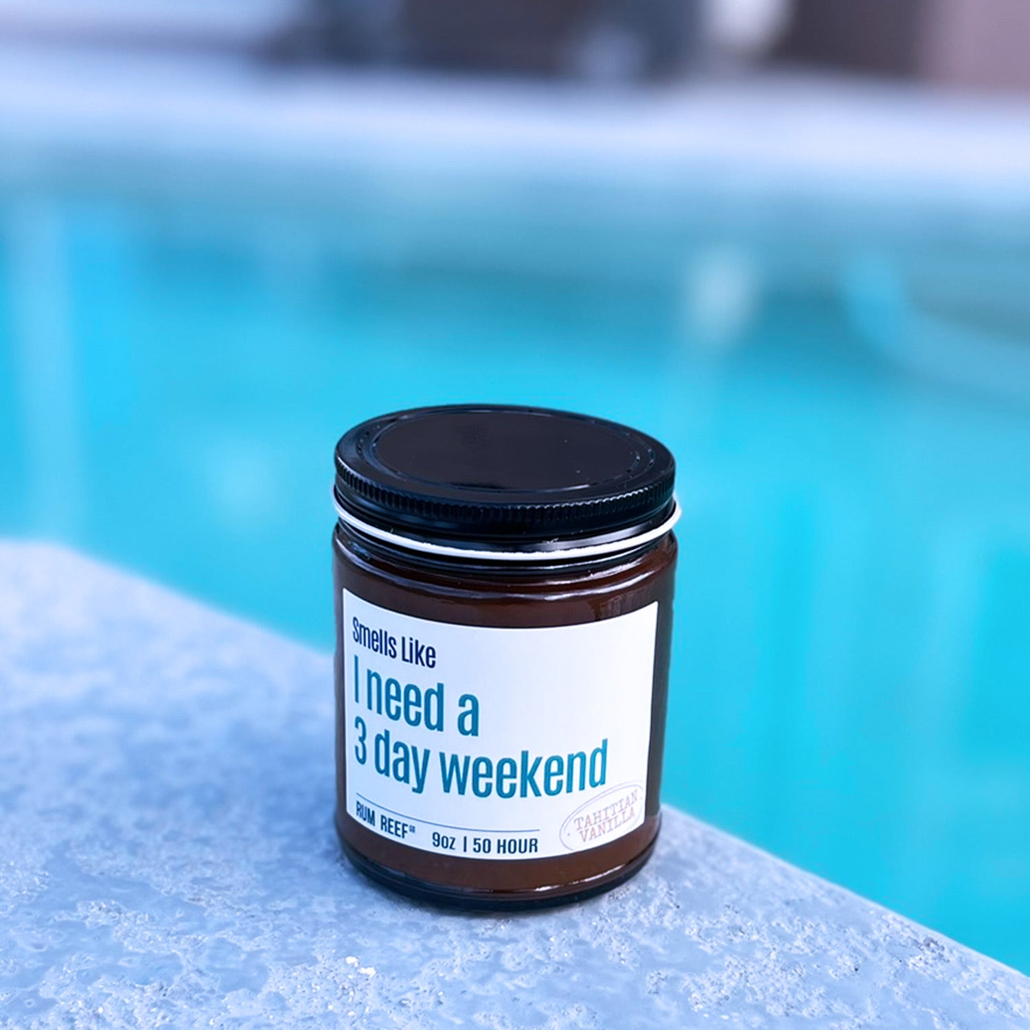 Jar with a label reading 'I need a 3 day weekend' by a pool