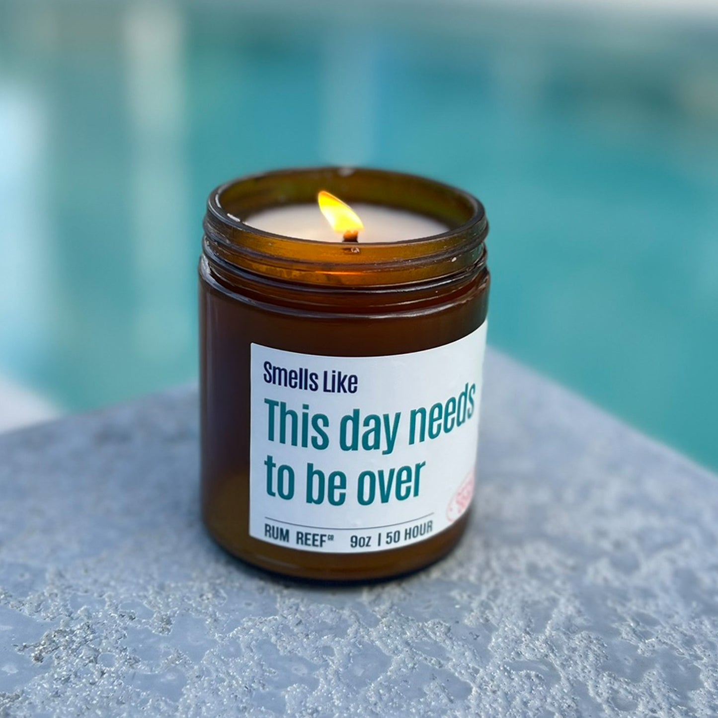 Candle lit by a pool